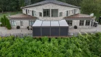 Aerial view of a pergola on a deck at high elevation with privacy screens closed